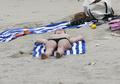 Kelly Brook sunbathing topless in St. Bart’s (1/2008)
